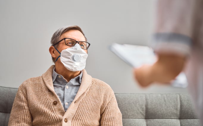 Senior man wears a mask to protect himself from viruses and bacteria. 